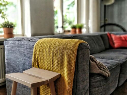 Decorative throws make great rug alternatives to a homely environment