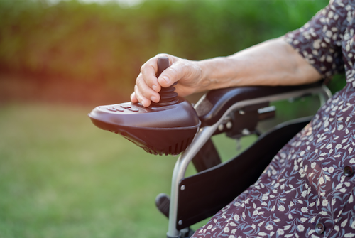 elderly woman on electric wheelchair